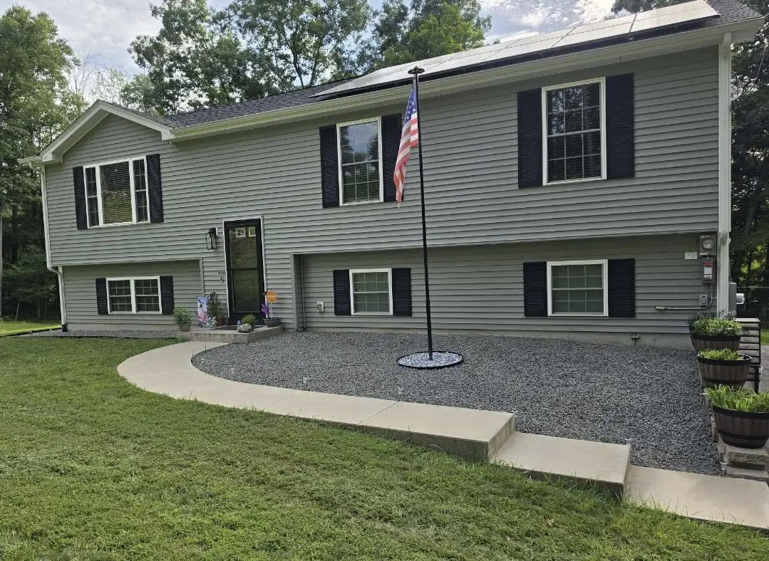 After: gray stone bed along the walkway