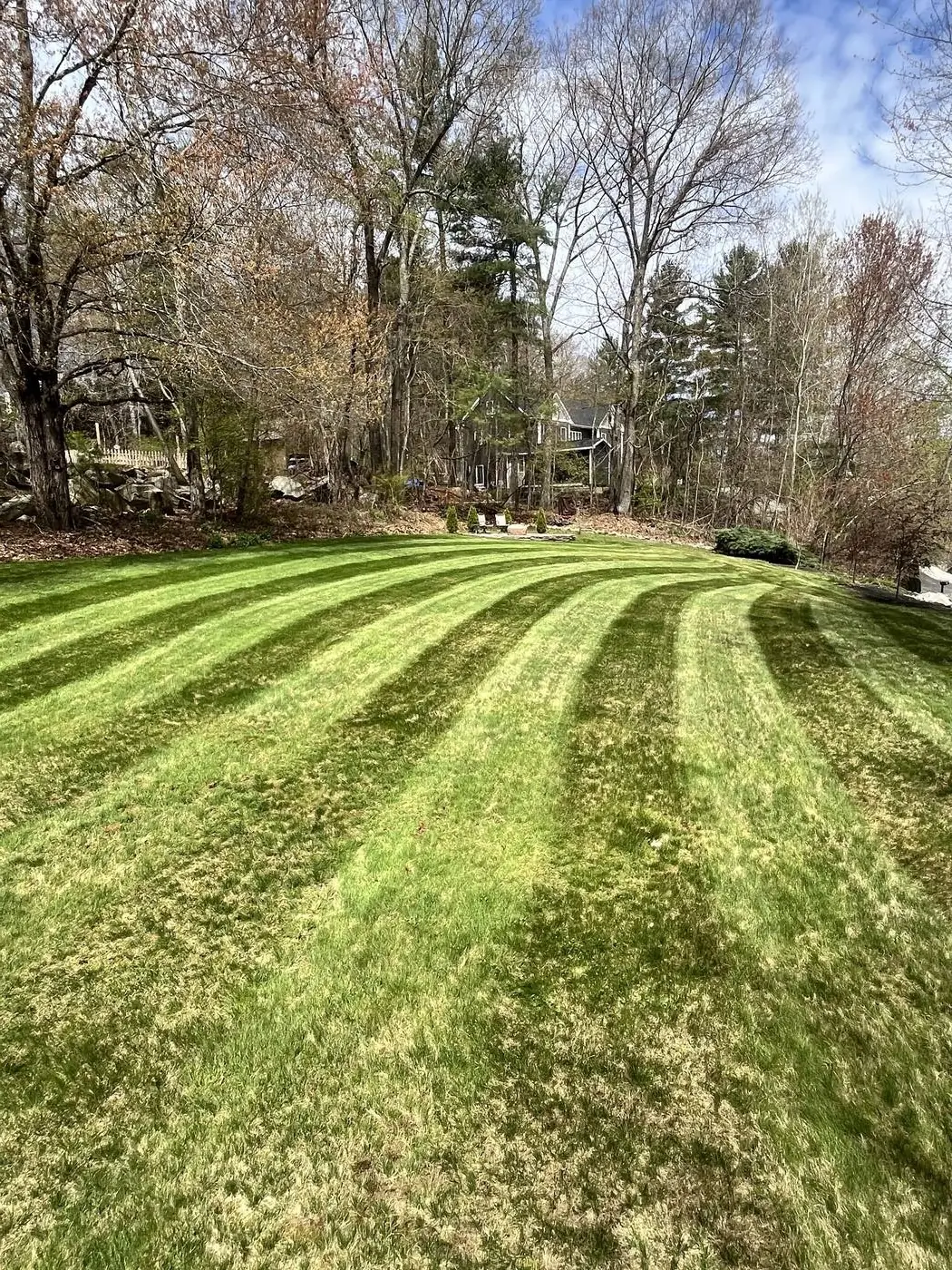 Expert lawn mowing and routine grass maintenance for a neat, well-kept property in Charlton, MA.