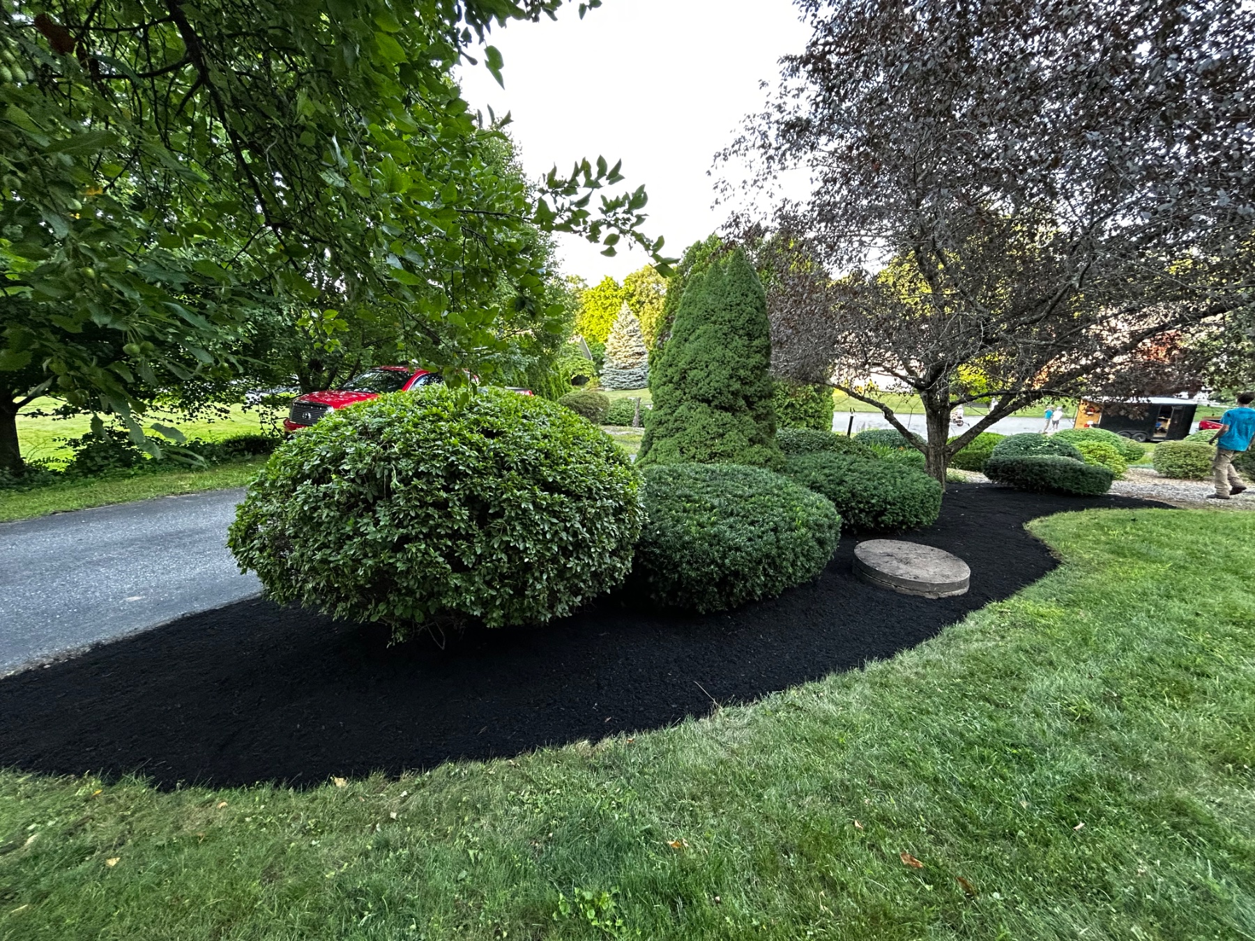 Professional landscape mulching for beautiful, weed-resistant garden beds in Oxford, MA.